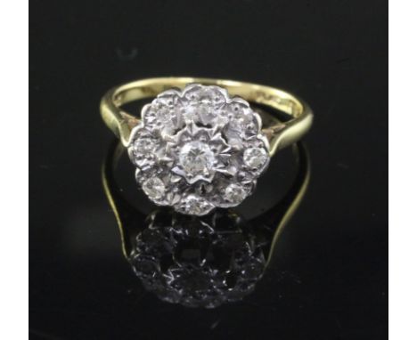 An 18ct gold, platinum and illusion set diamond nine-stone cluster ring, size O.