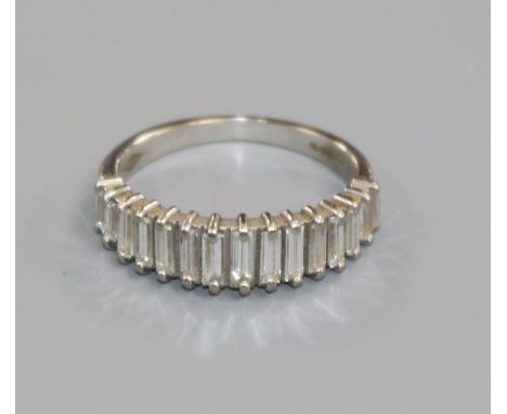 A modern 18ct white gold and baguette cut diamond half hoop ring, size K.