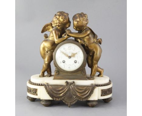 An early 20th century French ormolu mounted marble mantel clock, retailed by Charles Frodsham, the signed 3.5 inch Arabic ena