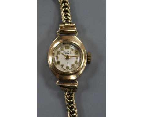 A lady's 9ct gold Bentimo manual wind wrist watch on a 9ct gold bracelet.