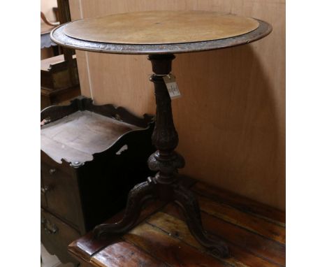 A circular Victorian walnut tripod table W.59.5cm