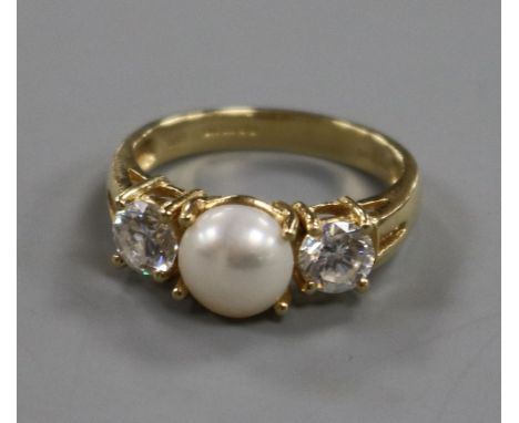 A 14ct gold, three stone cultured pearl and cubic zirconia dress ring, size O.