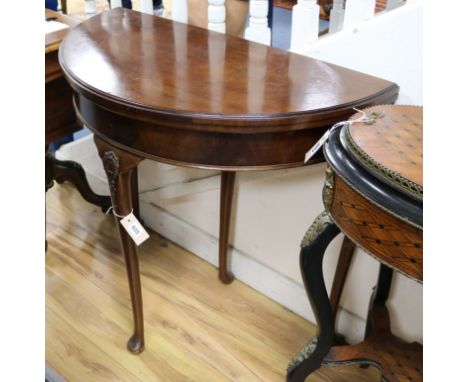 An Edwardian mahogany demi-lune card table W.86cm