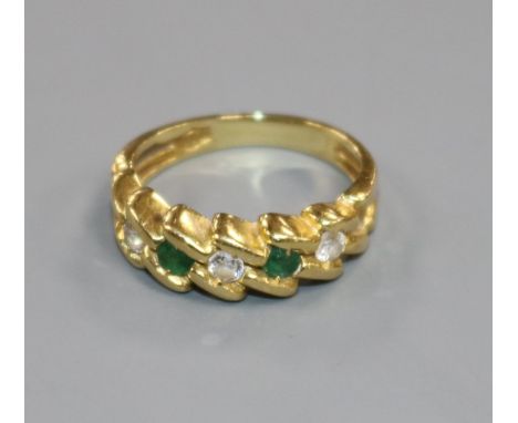 A modern 18ct gold, five stone emerald and diamond set half hoop ring, size F/G.