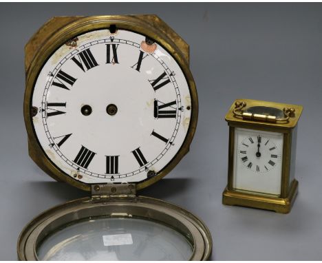 A brass carriage clock and brass ships bulkhead clock