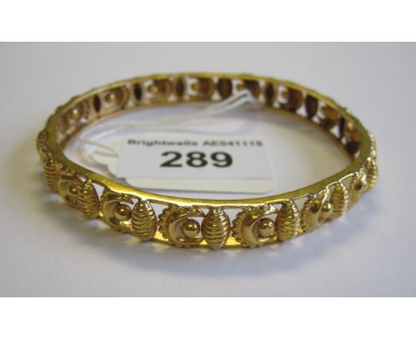 A gold pierced Bangle crescent design, approx 14.20gms