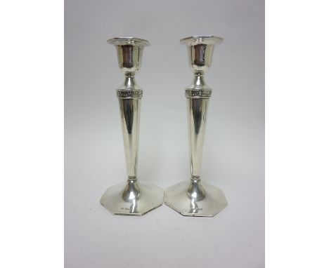 A pair of George V silver Candlesticks with tapering columns on octagonal bases, Sheffield 1918, 8 1/2in, Walker & Hall