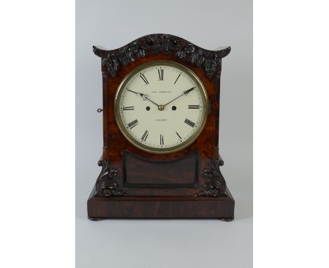 An early 19th Century mahogany cased Bracket Clock with white enamel circular dial inscribed Edward Johnson, Derby, two train