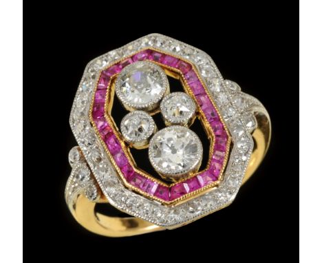 An Art Deco style Diamond and Ruby Ring millegrain-set four principle old-cut diamonds within openwork border of calibre-cut 