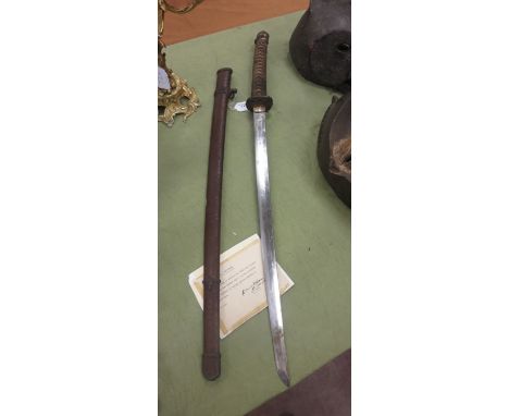 A Japanese Katana Sword, bound and fish skin grip and metal scabbard with letter of provenance