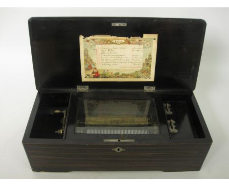 A Swiss Musical Box playing 8 airs, 6 1/4in cylinder, in a floral inlaid rosewood box, 17in