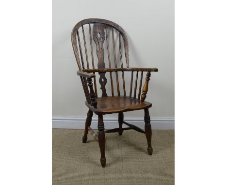 A 19th Century Windsor Elbow Chair with pierced splat and stick back, solid seat on turned legs