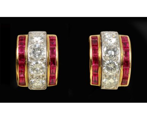 A pair of Ruby and Diamond Earrings each pav-set row of four brilliant-cut diamonds between two rows calibre-cut rubies