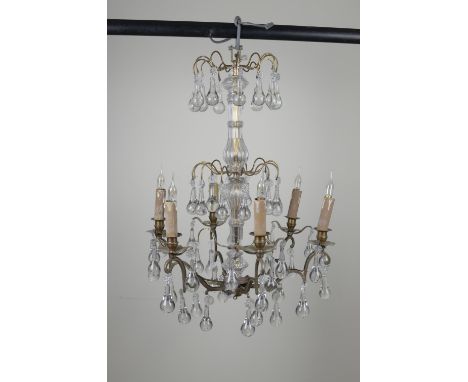 A French glass and brass six branch Chandelier with three tiers of glass drops