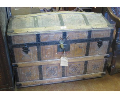 A 19th Century leather covered dome topped Travelling Trunk bound with pine and iron strips
