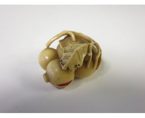 A 19th Century Japanese Netsuke carved as fruit, 1 1/2in, signed