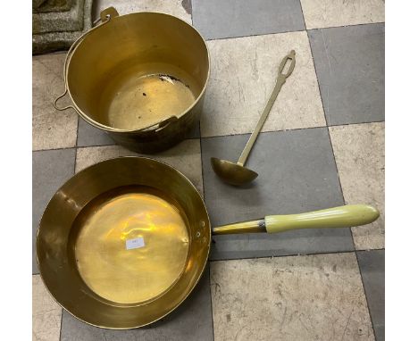 A brass jam pan, ladle and saucepan 