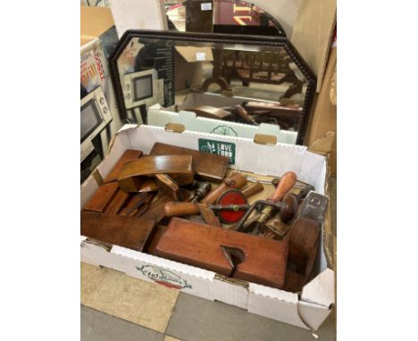 A collection of vintage wood planes and an oak framed mirror 