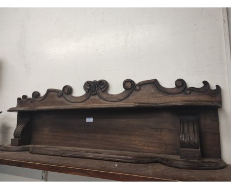 A 19th Century carved oak wall shelf 