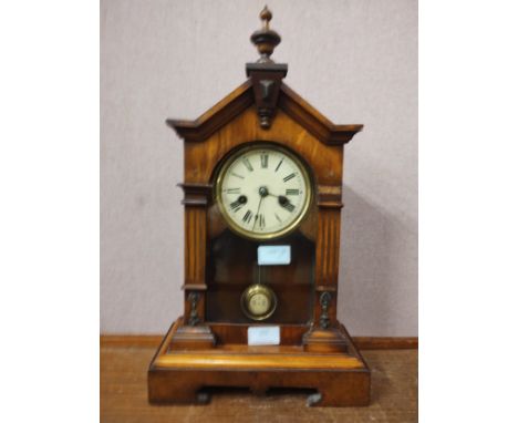 A carved beech mantle clock 