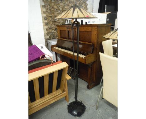 A modern standard lamp with a Tiffany style shade on a metal base, 61 high