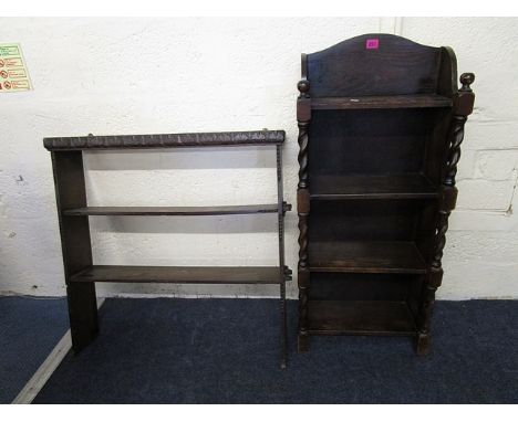An early 20th century oak open bookcase with barley twist columns and a carved oak wall hanging shelf unit