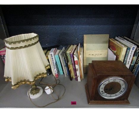 A small quantity of hardback books, an early 20th century album containing colonial and foreign stamps, an oak cased Bentine 