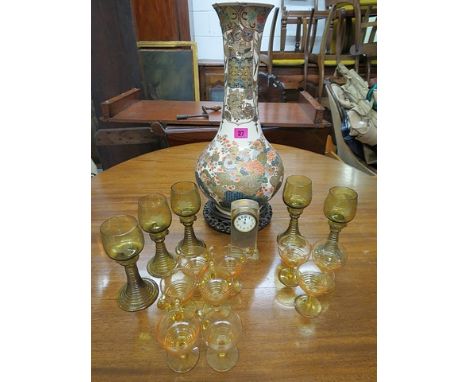 A Satsuma vase A/F on rosewood stand, Stuart custard glasses, pedestal glasses and a small glass cased mantle clock with an e