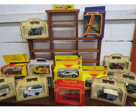 A collection of boxed toy vehicles to include die cast Days Gone By, together with a wall mounted shelf unit