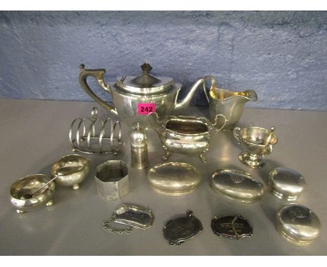 A selection of silver items to include a George Unite silver toast rack, an early 20th century silver teapot and matching cre