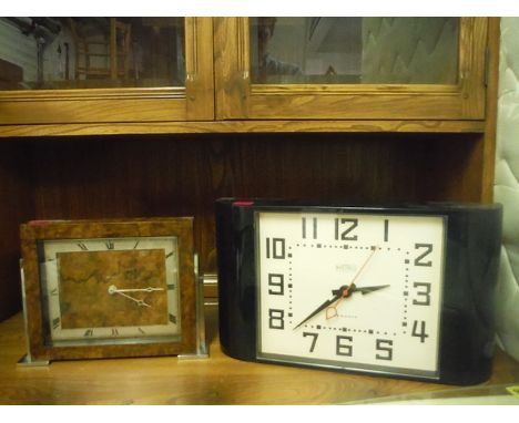 A 1930s walnut and chrome mantle clock with a later quartz movement and Roman dial, 9 high, along with a modern black plastic
