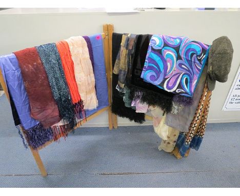 A collection of ladies scarves and wraps to include vintage Saldarini, Besarani together with a Barbour tweed flat cap