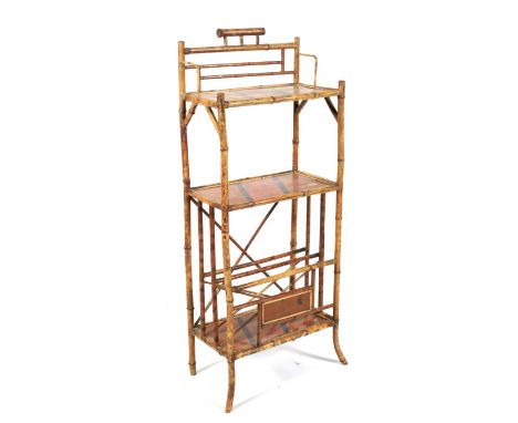 A late 19th century Aesthetic Movement chinoiserie bamboo three tiered stand. With three red lacquered tiers decorated with f