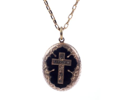 A Victorian gold-plated memorial locket and a chain. The oval 'back and front' locket with a central Latin cross inscribed 'I