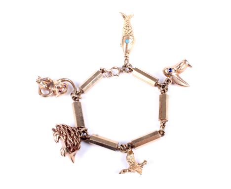 A vintage gold fancy faceted-cylinder link charm bracelet on a bolt-ring clasp with charms. Stamped '9' & '.375', and hung wi