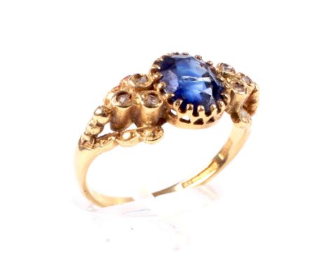 A vintage 18ct gold, sapphire and diamond dress ring. Centred with an oval mixed-cut sapphire, approx 2.08cts, rub-over set b