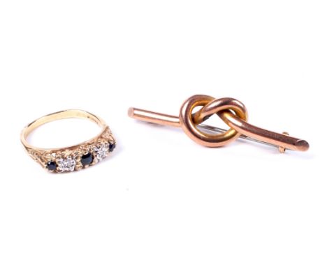 A 9ct gold, tiny sapphire and diamond five stone ring and a gold lovers knot brooch. The first with hallmarks for London 1992