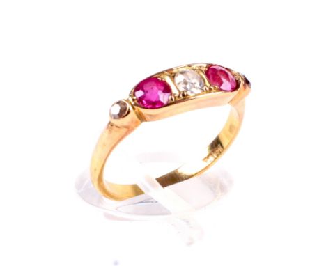 An early 20th century gold, pink sapphire and diamond five stone panel ring and a box. Centred with an old-cut diamond approx