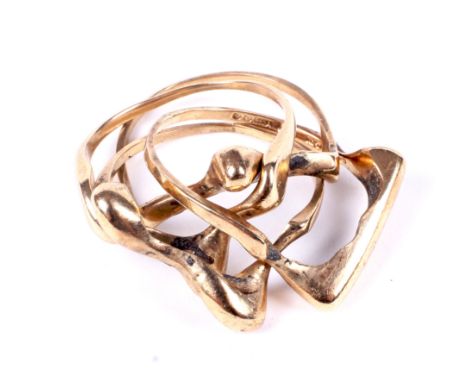 A vintage 9ct gold four-piece puzzle ring. Each piece with an abstract head, hallmarks for Birmingham 1977, size unknown, 10.