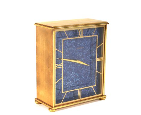 A mid century brass cased Jaeger le Coultre Swiss mantle clock. The Lapis Lazuli style face with gilt Roman numerals denoting