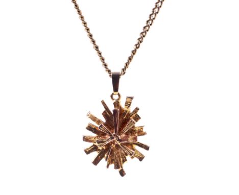 A 9ct gold abstract star-burst pendant necklace. The pendant with hallmarks for Birmingham 1972, approx. 24mm high overall, 2