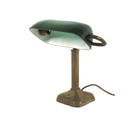 An early 20th century brass and green glass banker's desk lamp. With domed cased green and white glass shade, on square suppo