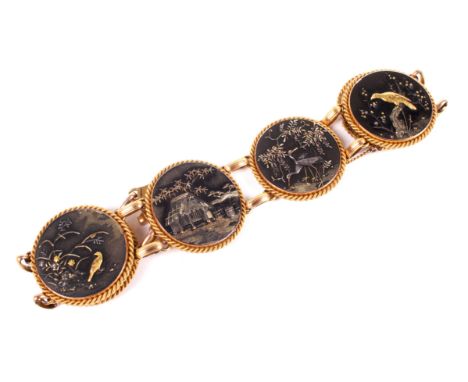 A late Victorian gold and Japanese shakudo panel bracelet. The six round shakudo panels approx. 24mm diameter and depicting b