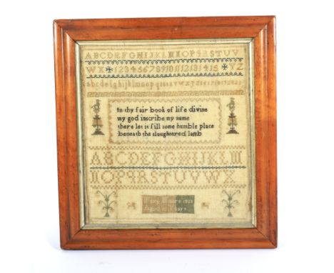 An early 19th century needlework sampler.  By Mary Moore 1825, Aged 15 Years, with the alphabet, numbers and religious verse 