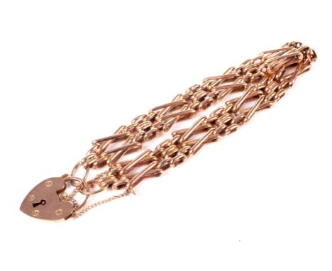 A vintage 9ct rose gold, fancy saltire and block bracelet. 10.5mm wide. Import hallmarks for London 1989, on an associated ea