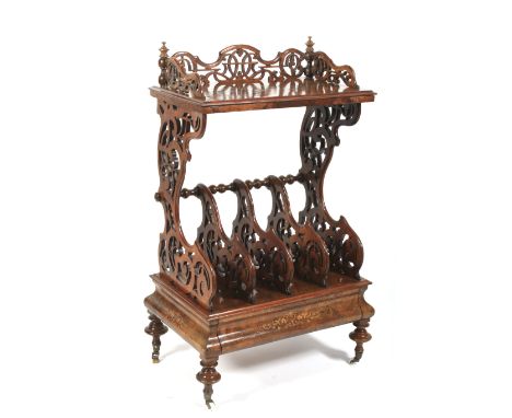 A mid Victorian inlaid walnut veneered etagere canterbury. The rectangular top with a scroll carved and pierced gallery above