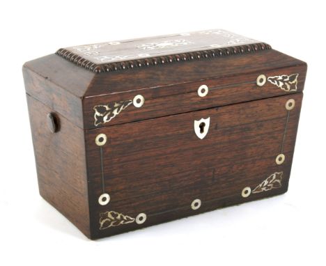A mid-19th century rosewood and mother-of pearl-inlaid tea caddy. Inlaid with foliate cartouche and leaves, the interior with