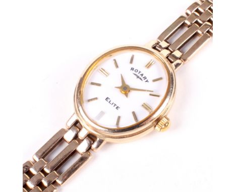 A vintage ladies 9ct gold Rotary elite wristwatch. The white dial with gilt batons denoting hours, on gate link 9ct gold brac