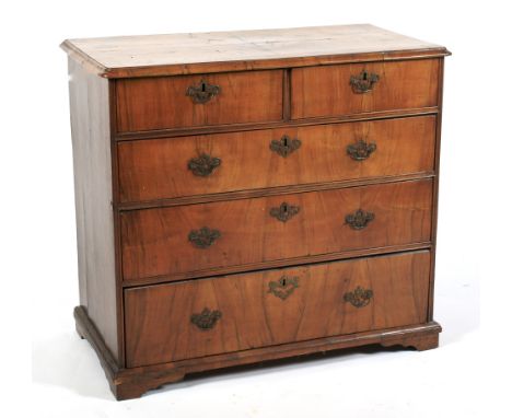 A 19th century burr walnut chest of drawers. The quartered and crossbanded moulded top above two short and three long graduat