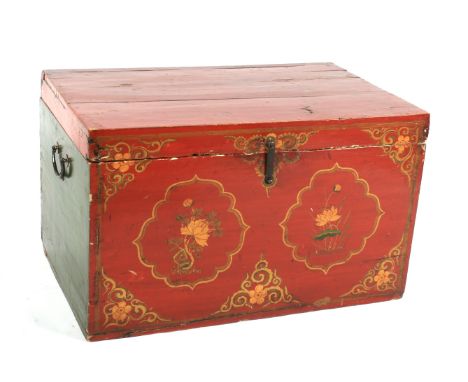 A vintage Chinese style red and gilt lacquered blanket chest and hinged cover. Painted and gilt with lappet-shaped cartouches